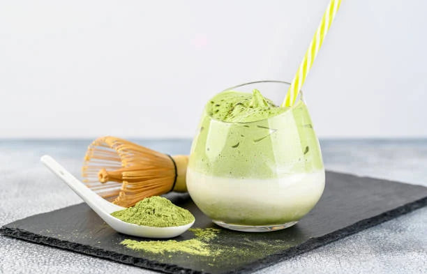 Prepared ReviTEAlize matcha latte in a mug, natural morning kitchen